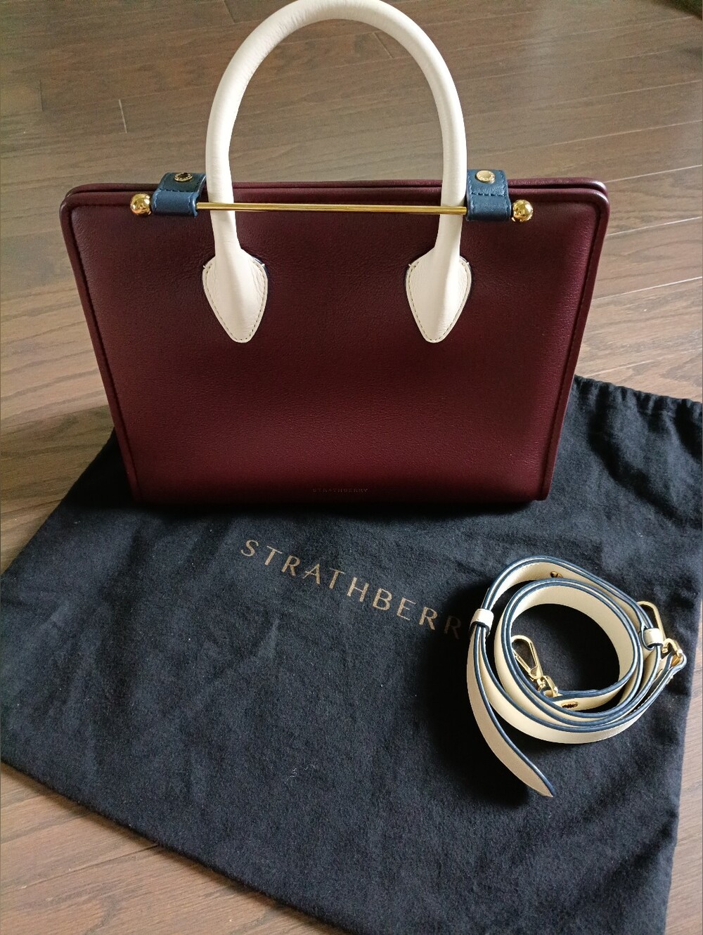Strathberry Midi Tote in Burgundy with White Handles and Navy Accents